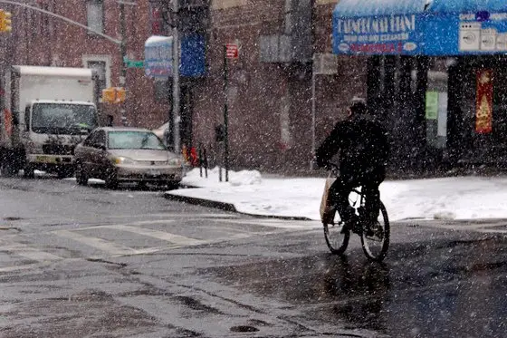Bike delivery person in snow